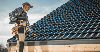 Man inspecting a roof